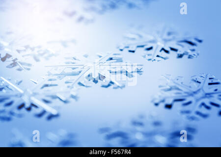 Minimalistic Christmas Greeting Card. Metallic Snowflakes Close Up on Blue Background. Selective Focus. Stock Photo