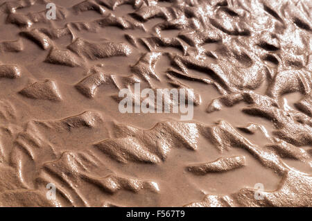 Patterns in the sand created by the receding tide. Stock Photo