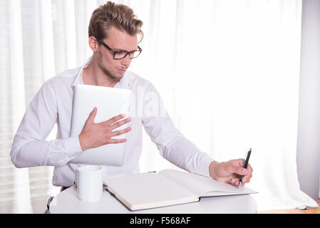 young business man taking notes Stock Photo