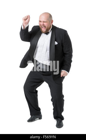 Jolly Fat Man in Tuxedo and Bow tie Shows Emotions, on white background Stock Photo