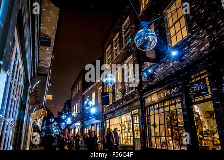 York, UK. 28th Oct, 2015. Illuminating York public art display. 'Join the Revolution' Freshwest – Marcus Beck & Simon Macro. Visitors are immersed in showers of light as they stream down one of Britain's best known streets, Shambles, reflected from a canopy of moving mirror balls. Freshwest's approach to illuminating York provides an encounter between the city's Medieval heritage and the playful kitsch of the modern ballroom. Credit:  Bailey-Cooper Photography/Alamy Live News Stock Photo