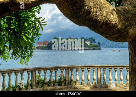 Tree framed view of Isola Bella on Lake Maggiore in summer. Stock Photo