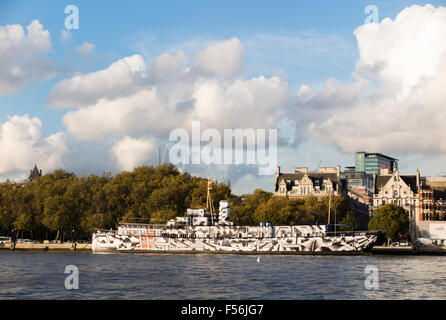 HMS President, a Grimsby Class sloop moored on the Embankment, London, one of three surviving WW1 warships, painted in a dazzle design Stock Photo