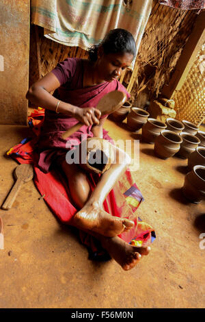 Village lady potter working to create a vase in India Stock Photo