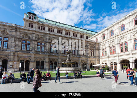 VIENNA, AUSTRIA - SEPTEMBER 27, 2015: People on Herbert-von-Karajan-Platz near Vienna State Opera House. Wiener Staatsoper produ Stock Photo