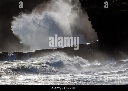 Waves crashing into cliff near Troswick, South Mainland Shetland, Scotland Stock Photo