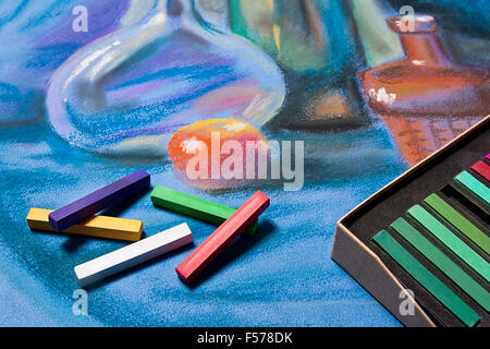 Artists chalk pastels and original pastel drawing of still life on the background. Stock Photo