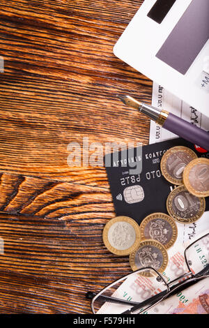 Business composition of the coins, calculator and charts Stock Photo