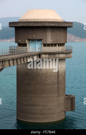 It's a photo of a tower in a water reservoir. it is to regulate the water level of the tank. It has a bridge to access to it Stock Photo