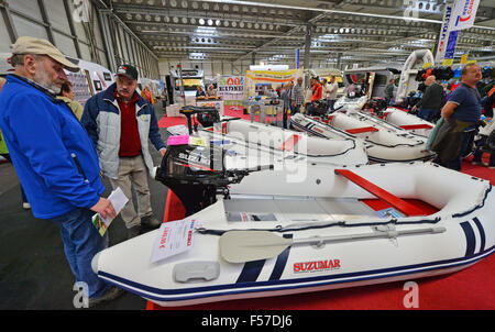 Visitors look at various rubber boats at the 'Travel & Caravan' tourism trade fair in Erfurt, Germany, 29 October 2015. According to the organizers, around 270 exhibitors are offering travel destinations all over the world. Interested people can also get an overview of the caravan market. Nearly 30 brands of leading manufacturers are present. Photo: MARTIN SCHUTT/dpa Stock Photo