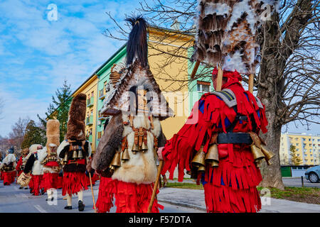 Bulgaria, Pernik Region, Dolna Sekirna town, carnival day, Kukeri procession, ferocious beasts with coats of fur and feathers an Stock Photo