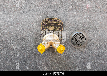 Combination fire standpipe and sprinkler on the wall of a building in Manhattan, New York Stock Photo