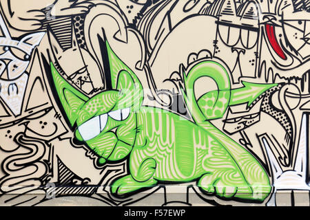 Green cat with grumpy face, graffiti, street art, urban art, Dusseldorf, North Rhine-Westphalia, Germany