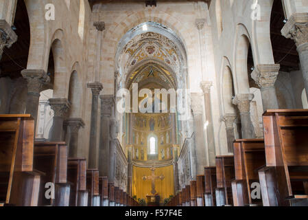 Christ Pantocrator mosaic in Nave of Cathedral Basilica of Cefalu, Sicily. Italy. Interior view towards the chancel. Stock Photo