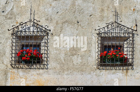 Windows on the 1636 Casa Chizzali Bonfadini house in Colle Santa Lucia in the Dolomites, Italy Stock Photo