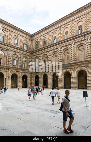 Florence,Italy-August 26,2014:Tourists walking around and waiting outside the Palazzo Pitti (Pitti Palace) during a cloudy day. Stock Photo