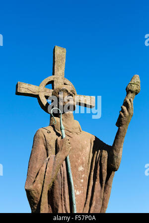 Statue of St Aidan (by sculptor Kathleen Parbury) in the grounds of Lindisfarne Priory, Holy Island, Northumberland, England, UK
