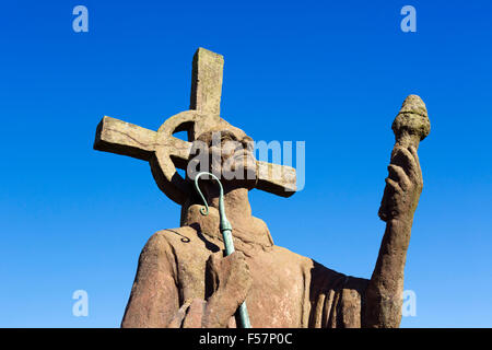 Statue of St Aidan (by sculptor Kathleen Parbury) in the grounds of Lindisfarne Priory, Holy Island, Northumberland, England, UK
