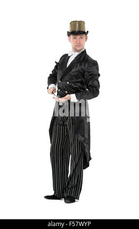 Illusionist Shows Tricks with a Magic Wand, on white background Stock Photo