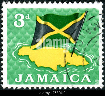 JAMAICA - CIRCA 1964: Postage stamp printed in Jamaica, shows Map and flag, circa 1964 Stock Photo