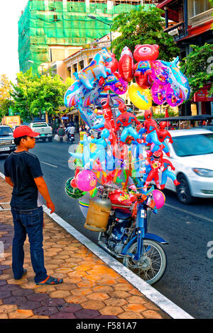 Balloon seller Phnom Penh Cambodia, Honda, Snow White, Spiderman, Shark, horse, fish Stock Photo