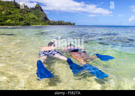 Snorkelers at Tunnels Beach on Kauai Stock Photo