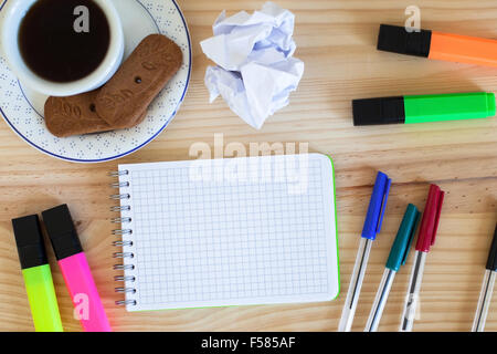 notepad and colorful markers on the table, top view Stock Photo