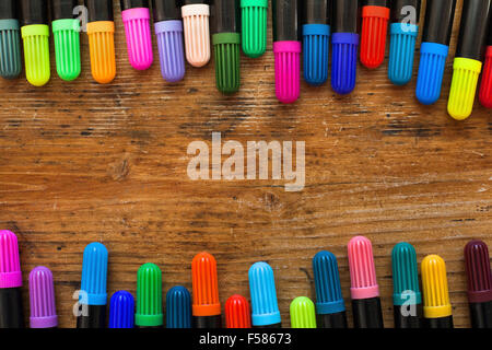 colorful markers on wooden desk, background Stock Photo