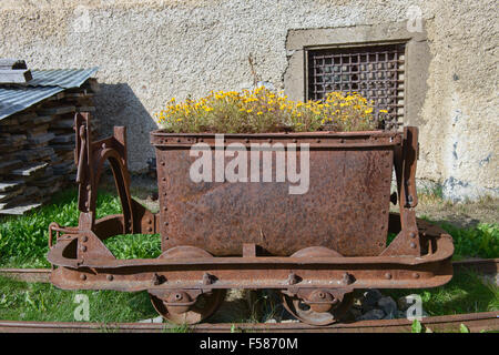 Old mining rail car at the 1636 Casa Chizzali Bonfadini house in Colle Santa Lucia in the Dolomites, Italy Stock Photo