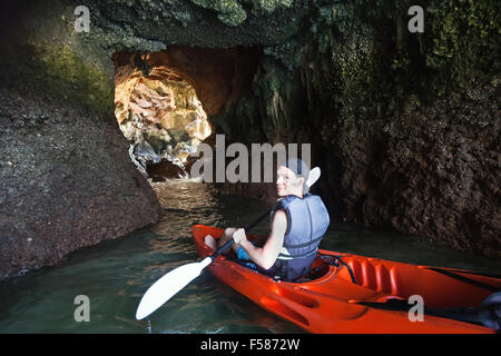 kayaking in the cave, outdoor extreme adventure Stock Photo