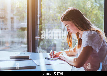 student in classroom during exam Stock Photo