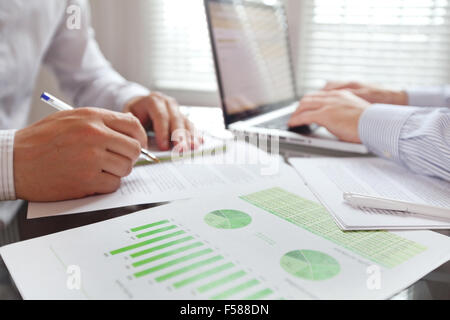 business people working in the office, focus on foreground Stock Photo