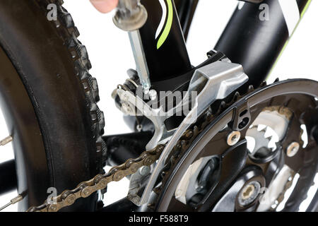 adjusting front derailleur of mountain bike (MTB) on a white background Stock Photo