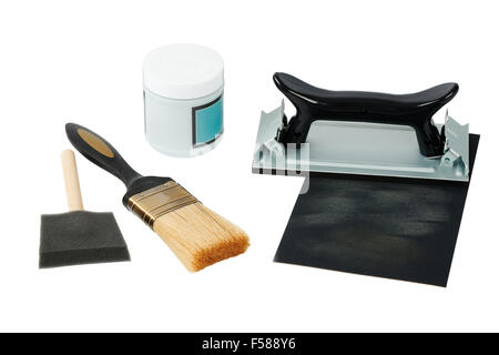 carpentry and painting tools, such as sandpaper holder, stack of veneers and paint brushes, isolated on white Stock Photo