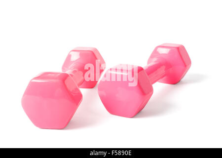 two dumbells covered with pink colored rubber, isolated on white. Stock Photo