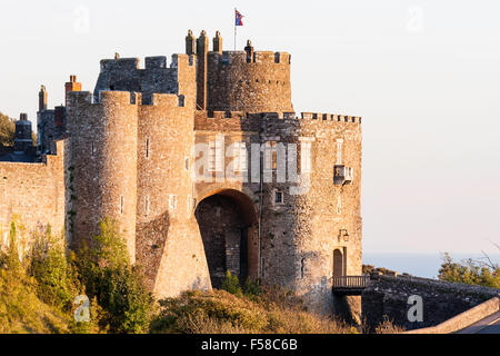 England, Dover castle. The imposing Constables Gate, side view with sunset light on the walls during the golden hour. Clear blue sky. Stock Photo