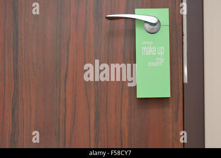 Please make up my room sign on door knob in hotel Stock Photo