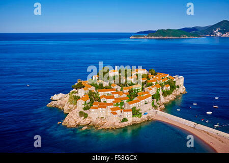 Montenegro, Adriatic coast, Bay of Budva, Island of Sveti Stefan (St. Stephen), once a fishing village, now a luxury hotel compl Stock Photo