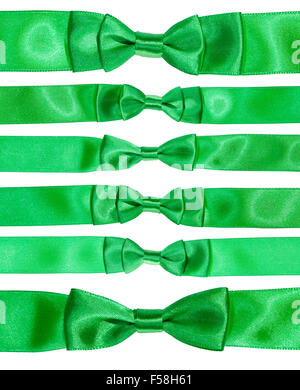 set of real bow knots on green satin ribbons isolated on white background Stock Photo