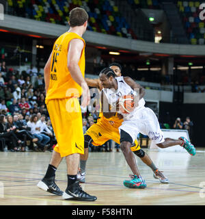 London, UK. 29th Oct, 2015. Manchester Giants player and head coach Yorick Williams (12) drives the ball forward in an attack with London's Brian Voelkel (15) and Nick Lewis (11) defending, during the London Lions vs. Manchester Giants BBL game at the Copper Box Arena in the Olympic Park. Manchester Giants win 90-82. Credit:  Imageplotter/Alamy Live News Stock Photo