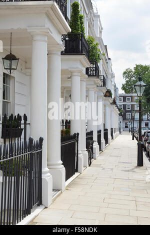 Row of beautiful white Edwardian houses in Kensington, London Stock Photo