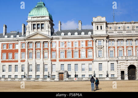 Couple on the parade ground facing towards the Old Admiralty palace from the Horse Guards Parade Stock Photo