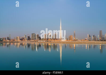 Skyline of skyscrapers and Burj Khalifa tower before sunrise in Dubai United Arab Emirates