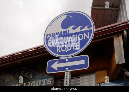 Evacuation route signpost showing direction of travel to safety in the event of a Tsunami in Ketchikan, Alaska, USA Stock Photo
