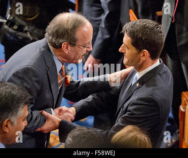 Washington, DC, USA. 29th October, 2015.  United States Representative Eliot Engel (Democrat of New York), the ranking member of the US House Foreign Relations Committee, left, greets incoming Speaker of the US House of Representatives Paul Ryan (Republican of Wisconsin), right, as the latter is escorted to the rostrum in the US House Chamber in the US Capitol in Washington, DC on Thursday, October 29, 2015. Credit:  dpa picture alliance/Alamy Live News Stock Photo