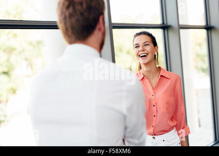 Happy business people shaking hands and being happy for meeting Stock Photo