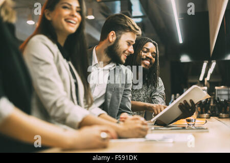 People discussing article in a pub after work Stock Photo