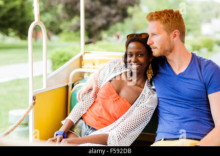Couple in love traveling by a scenic railway and being happy outdoors Stock Photo