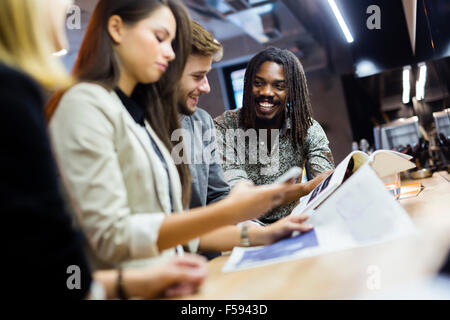 Group of people having fun in a bar after work Stock Photo