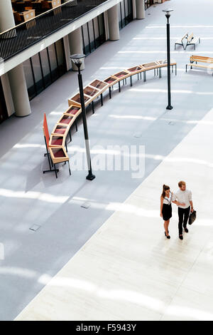 Business couple walking together. Top view Stock Photo